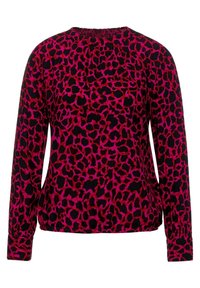 Langärmliges Oberteil aus schwarzem Stoff mit lebendigem pink-rotem Leopardenmuster. Gerüschter Ausschnitt und enganliegende Bündchen.