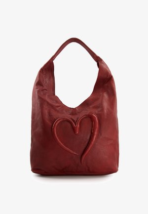 Soft red leather handbag with a single broad strap and a raised heart design embossed on the front center.