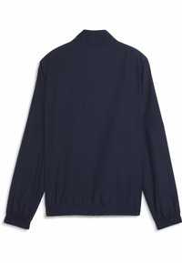 Veste bleu marine au toucher doux, avec des manches longues, un col et des poignets et ourlet élastiqués pour une silhouette ajustée.