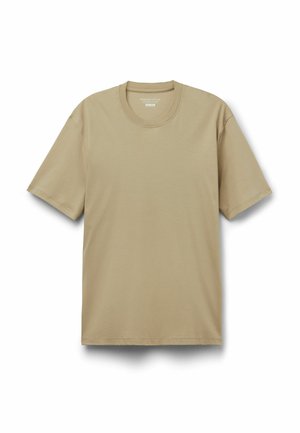 Béžové bavlněné tričko s krátkým rukávem a kulatým výstřihem, rozložené na bílém pozadí.