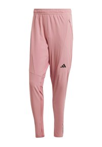 Rosa Sporthosen aus leichtem Stoff, mit einem Kordelzugbund, taillierter Form, seitlichen Reißverschlusstaschen und einem schwarzen Logodetail.