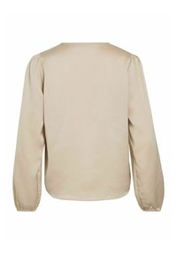 Beige bluse med lange ermer laget av glatt stoff. Har puffede ermer og en rundet halslinning. Enkel, minimalistisk bakside.