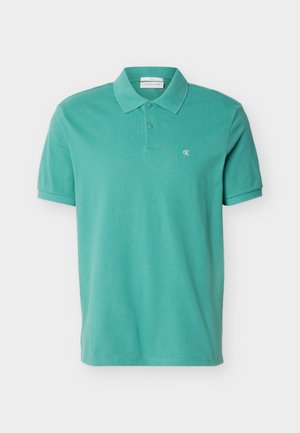 Teal short-sleeve polo shirt with collar and two buttons, featuring small white "cK" logo on left chest.
