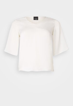 Bluză albă fluidă dintr-un material ușor, cu decolteu în V și mâneci largi. Textură fină, cu o croială lejeră și tiv drept.