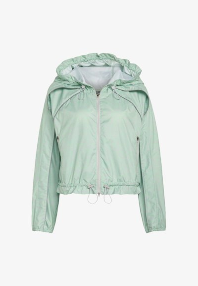 Lysegrøn hættetrøje med lynlås, elastiske manchetter, justerbare snore ved hætten og kanten samt sidelommer med lynlås.