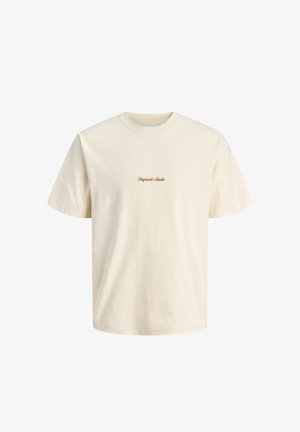 T-shirt in cotone color crema con maniche corte e scollo a girocollo. Presenta la scritta "Original Studio" ricamata in marrone sul petto.