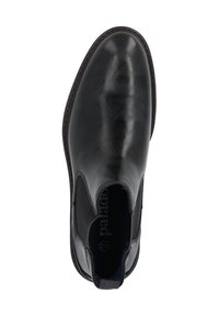 Bottines chelsea en cuir noir avec panneaux élastiques sur les côtés, bout arrondi et coutures contrastantes le long de la semelle. Texture douce et design minimaliste.