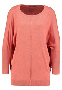 Koronkowy, oversize sweter w kolorze koralowym z okrągłym dekoltem, długimi rękawami, ściągaczami przy rękawach i u podstawy. Wykonany z miękkiej dzianiny o gładkiej fakturze.