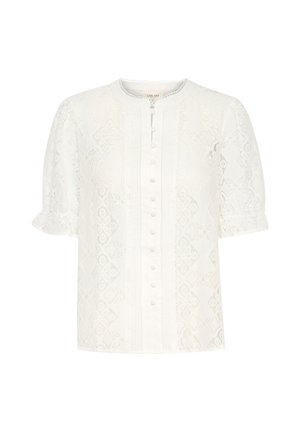 Blouse en dentelle blanche avec un col rond, des manches bouffantes courtes et un devant à boutons. Détails avec des motifs floraux et une texture subtile.