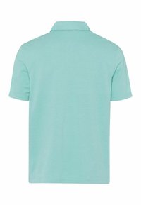 Polo a maniche corte di color verde menta, realizzato in cotone morbido, con colletto classico e orlo dritto. Design semplice e in tinta unita.