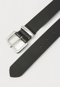Black leather belt with a silver metal buckle, featuring a smooth texture and multiple holes for adjustability. Accented with stitching.
