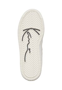 Biała podeszwa buta z wzorem jodełki i czarnym abstrakcyjnym wzorem przypominającym twarz i kapelusz na środku.