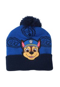 Cappello di lana blu a maglia con pom pom sulla parte superiore, caratterizzato da un volto di cane in stile cartone animato nella parte frontale e una fascia inferiore a coste di un blu scuro.