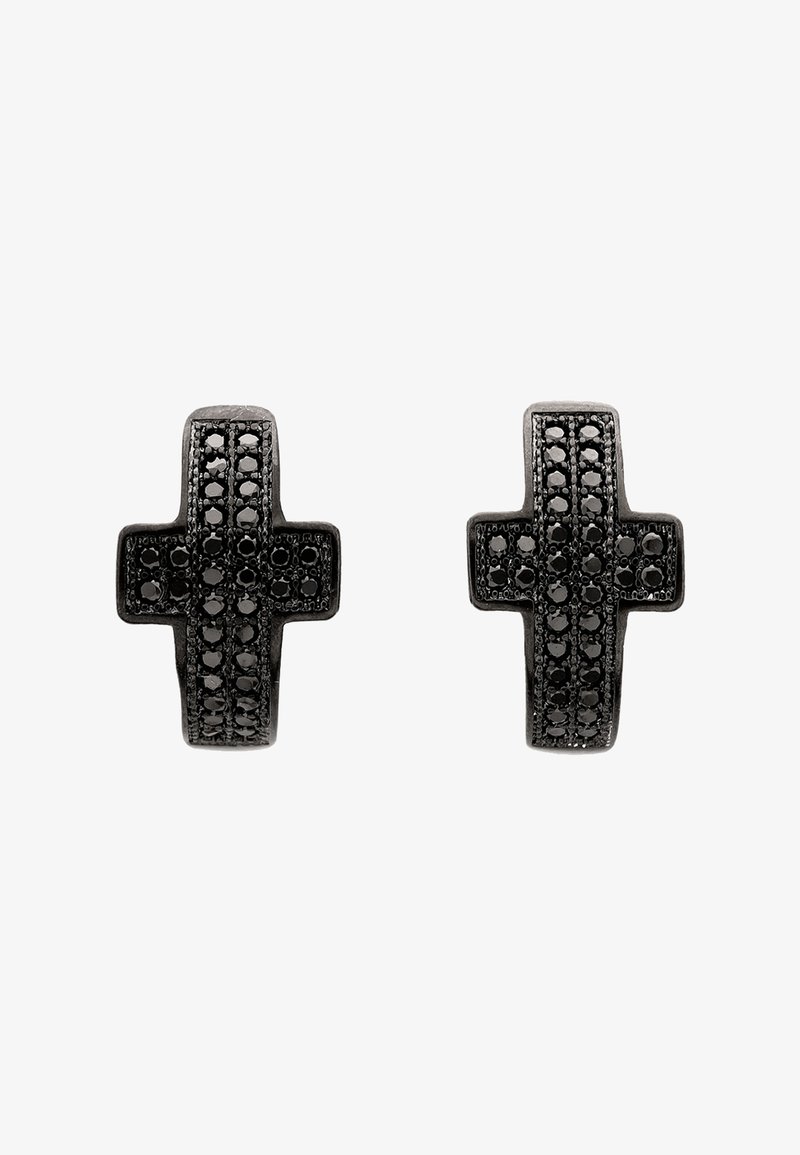 Een paar zwarte oorbellen in de vorm van een kruis met verticale rijen van kleine zwarte stenen op een witte achtergrond.