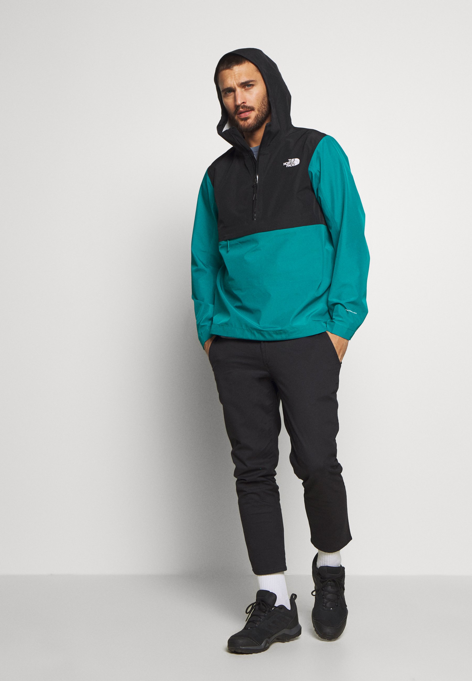 green and grey north face jacket