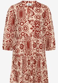 Red and beige patterned dress with three-quarter sleeves, v-neck, tiered design, floral motifs, and intricate borders. Lightweight fabric.