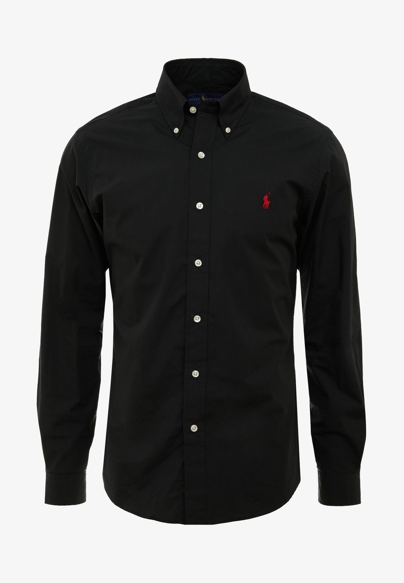 Camisa negra de manga larga y botones, hecha de algodón. Cuenta con cuello, botones blancos y un logo bordado en rojo en el lado izquierdo del pecho.