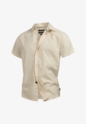 Camicia beige a maniche corte realizzata in tessuto leggero, con chiusura frontale a bottoni, colletto casual e una piccola etichetta del marchio sul lato.