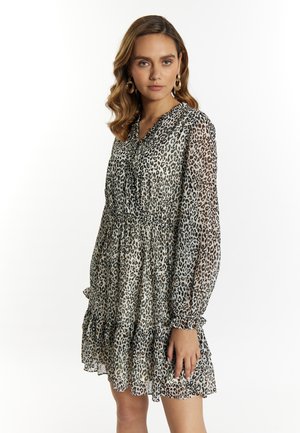 Kleid mit Leopardenmuster, langen Ärmeln, gerüschtem Saum und tailliertem Schnitt. Hergestellt aus leichtem, transparentem Stoff mit einem gestuften Design.