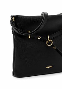 Black textured leather handbag with gold hardware, adjustable strap, and "SURI FREY" logo in gold lettering on front.