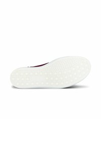 Shoe sole with a white, textured rubber surface featuring a dotted pattern, providing grip and durability.