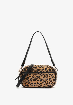 Leopard print handbag with a beige background and black spots, featuring black leather accents and removable shoulder strap. Zipper closure.