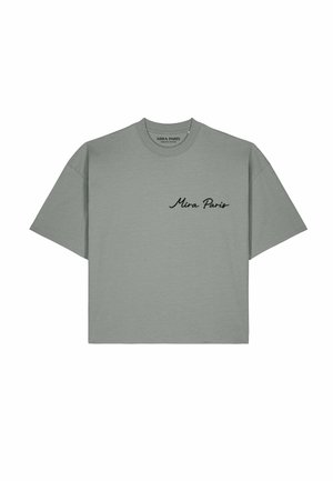 T-shirt gris à manches courtes avec texte en cursive noire ""Mira Paris"" sur la poitrine gauche et un col rond.