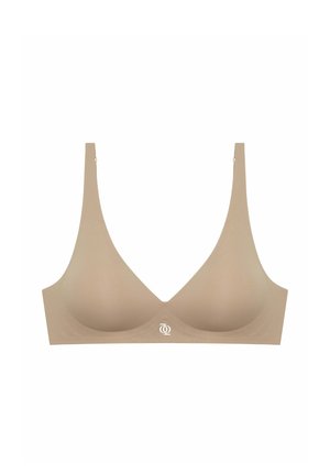 Soutien-gorge en tissu doux beige avec un design sans coutures, des bretelles larges et un logo discret au centre. Bonnets légèrement moulés pour la forme.