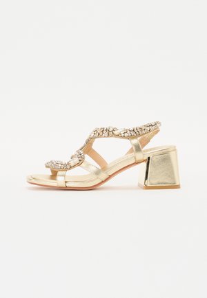 High heeled sandals - diva gold