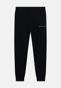 Pantalons de survêtement noirs en coton, avec une taille élastique et un cordon de serrage, et un petit logo blanc sur la cuisse. Design à jambe fuselée.