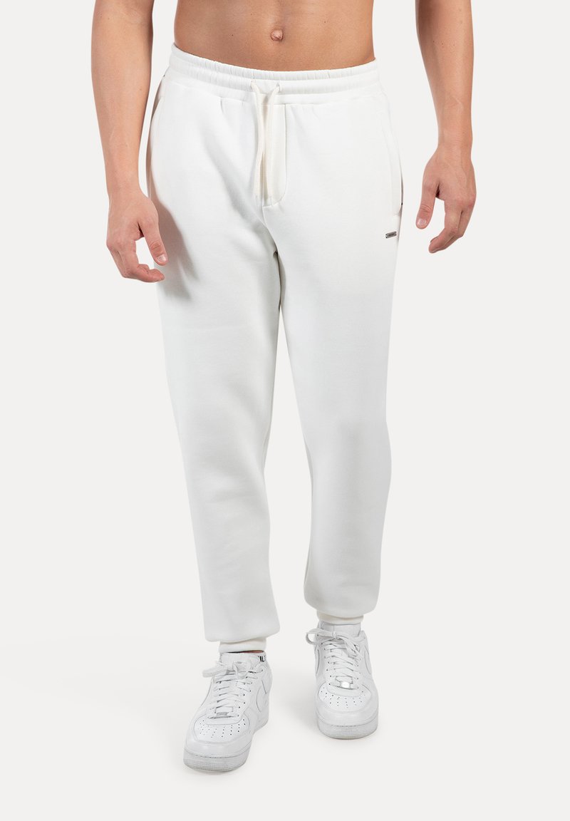 Pantalones de chándal blancos para hombre, hechos de una mezcla de algodón, con una textura suave, cinturilla elástica con cordón y bolsillos laterales.