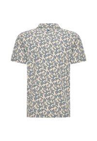 Koszula z krótkim rękawem w jasnym kremowym kolorze, z niebieskim wzorem liści, z kołnierzykiem i miękkim, gładkim materiałem.