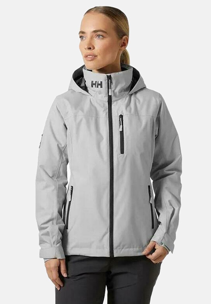 Gray waterproof jacket with a hood, black zipper, and side pockets. Features logo on the shoulder and black interior lining. Smooth texture.