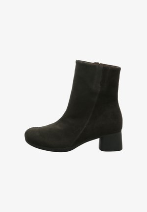 Black suede ankle boot with a rounded toe and a mid-height block heel. Features a smooth surface and vertical stitching on the sides.