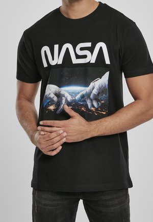 Black t-shirt with white NASA logo above two astronaut-gloved hands reaching toward each other against a space and Earth background.