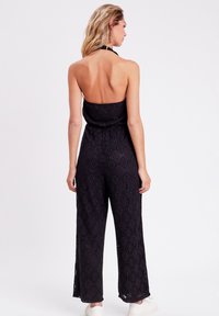 Cache Cache AUS MAKRAMEE - Tuta jumpsuit - noir