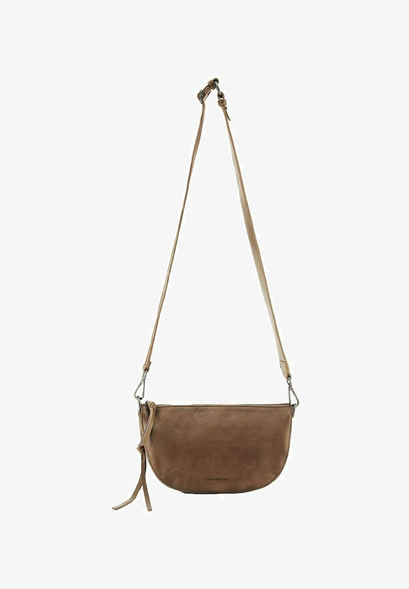 Brown leather crossbody bag with a curved shape, adjustable strap, and zipper closure. Textured surface and minimalist design.