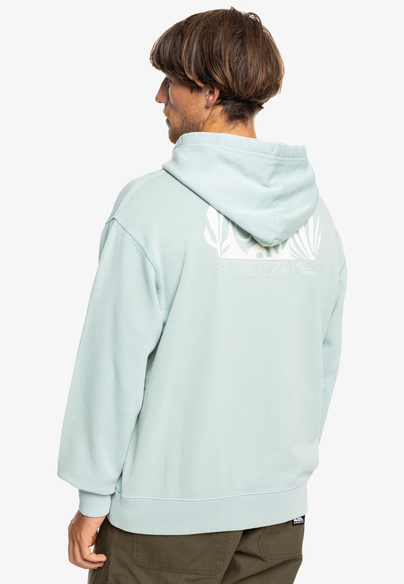 Light blue hoodie with a large white graphic design and logo on the back. Made of soft material, featuring a spacious hood and ribbed cuffs.