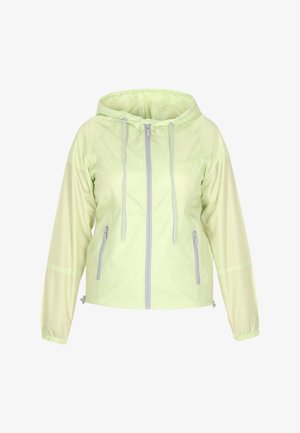 Giacca leggera di colore verde chiaro, con cappuccio, zip frontale completa, coulisse e polsini elasticizzati. Presenta due tasche laterali e una finitura lucida.