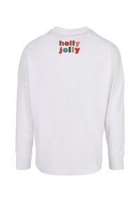Fehér, hosszú ujjú póló, amelyen színes "holly jolly" felirat található a hátsó felső részen, laza fazonban, bordázott mandzsettákkal.