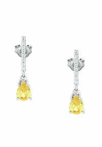 Orecchini a forma di goccia gialla con montatura in argento, decorati con una fila di piccoli cristalli trasparenti sopra la pietra principale. Superficie liscia e finitura lucida.