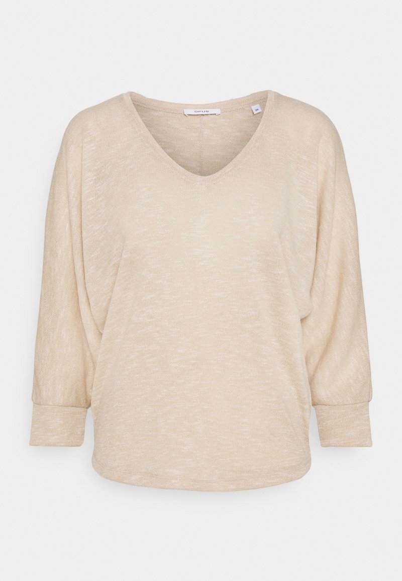 Pull beige léger avec un col en V et des manches dolman trois-quarts. Le tissu texturé présente un motif chiné subtil.