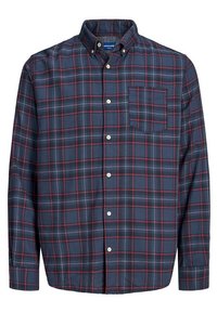 Dlouhý rukáv kárované košile v námořnické modři s červenými a bílými pruhy, která má jednu náprsní kapsu, límec na knoflíky a zapínání vpředu na knoflíky.