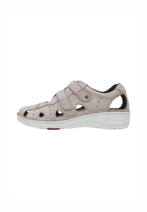 Beige leather closed-toe sandal with two adjustable hook-and-loop straps and white cushioned sole for casual wear.