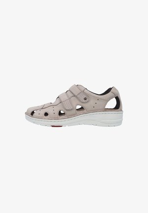 Beige leather closed-toe sandal with two adjustable hook-and-loop straps and white cushioned sole for casual wear.