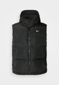 Veste sans manches matelassée noire avec fermeture éclair à l'avant, col haut avec boutons, poches latérales et petit logo Tommy Hilfiger sur la poitrine.
