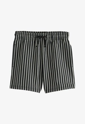 Crna tkanina s ravnomjerno raspoređenim horizontalnim bijelim prugama, prikazuje mekane nabore i pleteni teksturu u detaljnom prikazu izbliza.