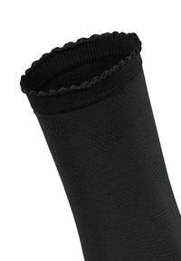 Sort knæhøje sokker med et tekstureret mønster, ribbet kant og bølget kant. Lavet af et elastisk materiale for en tætsiddende pasform.