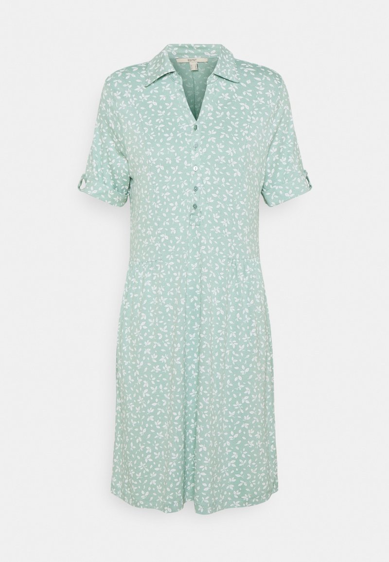 Robe vert clair à manches courtes avec motif feuilles blanches, boutonnée devant, col et manches retroussées avec pattes à boutons.