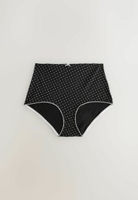 Culottes pour femmes taille haute en noir avec de petits motifs de cœurs blancs, un liseré blanc le long des ouvertures des jambes et un petit nœud blanc au centre de la ceinture.